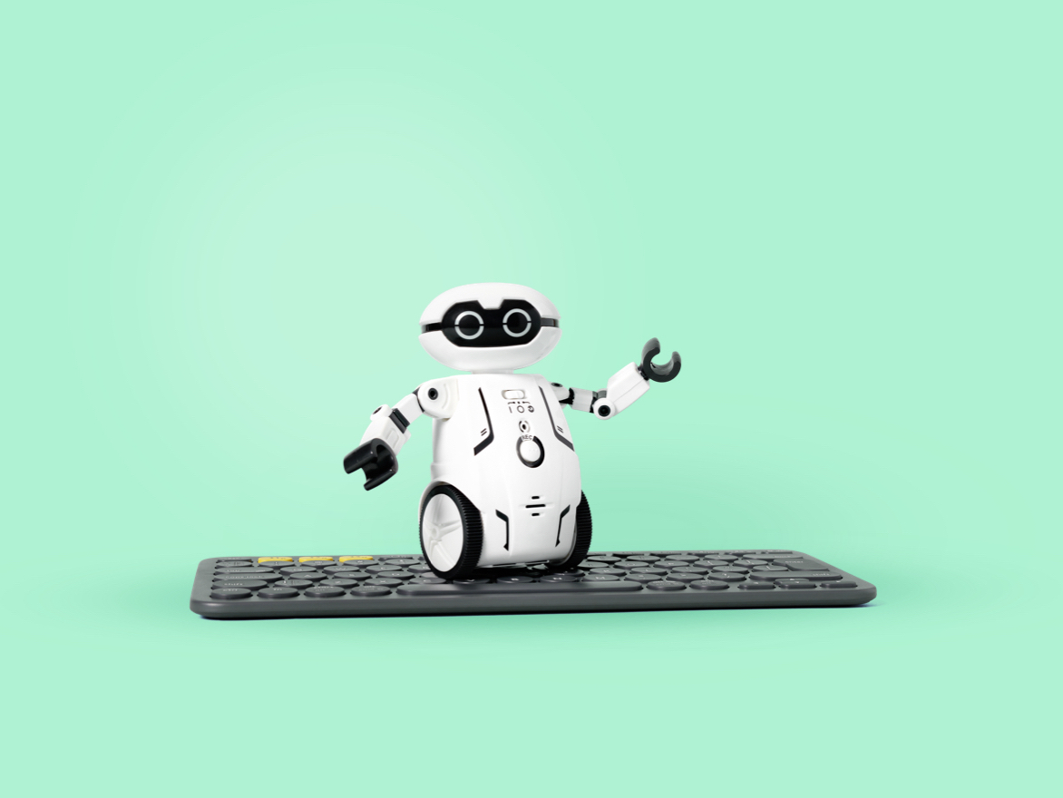 Cute LEGO® robot on top of a keyboard